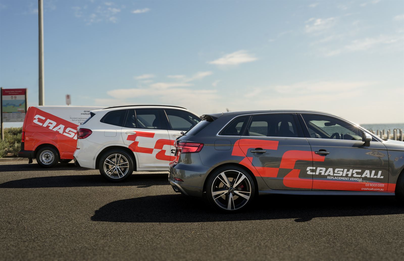 Two CrashCall replacement vehicles, a BMW X3 and an Audi A3, parked side by side