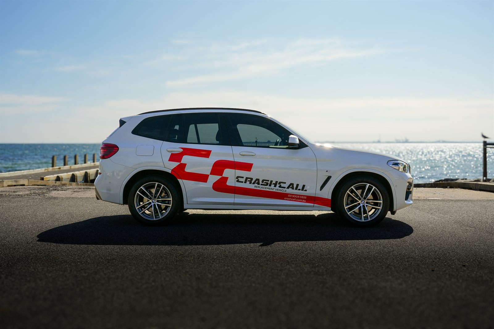 CrashCall branded BMW X3 replacement vehicle on the beachfront