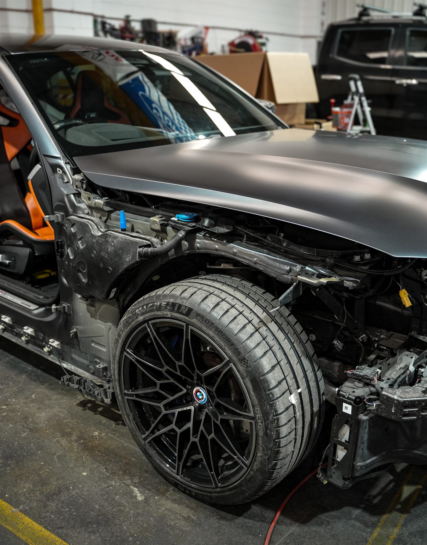 Vehicle in the workshop with body panels prepared for repair